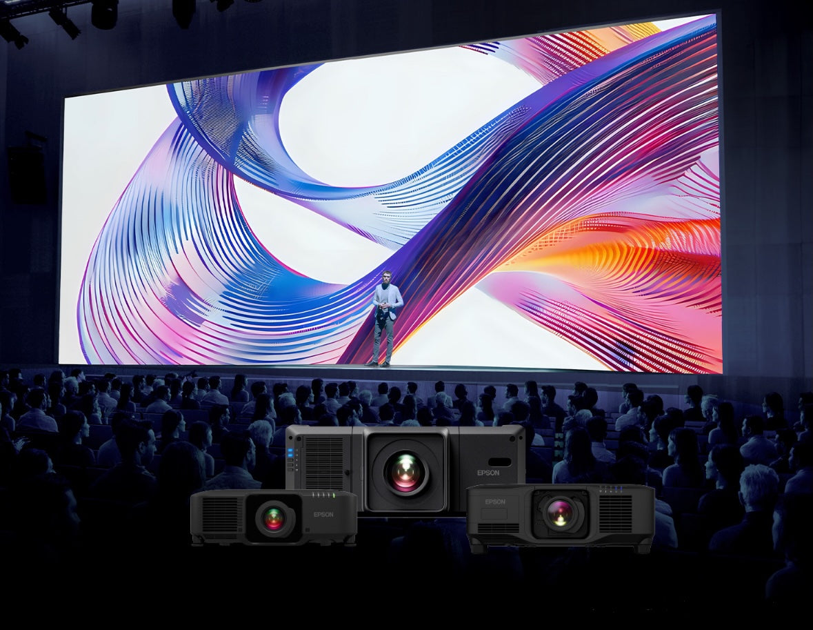Image of a person with Epson projector at large venue
